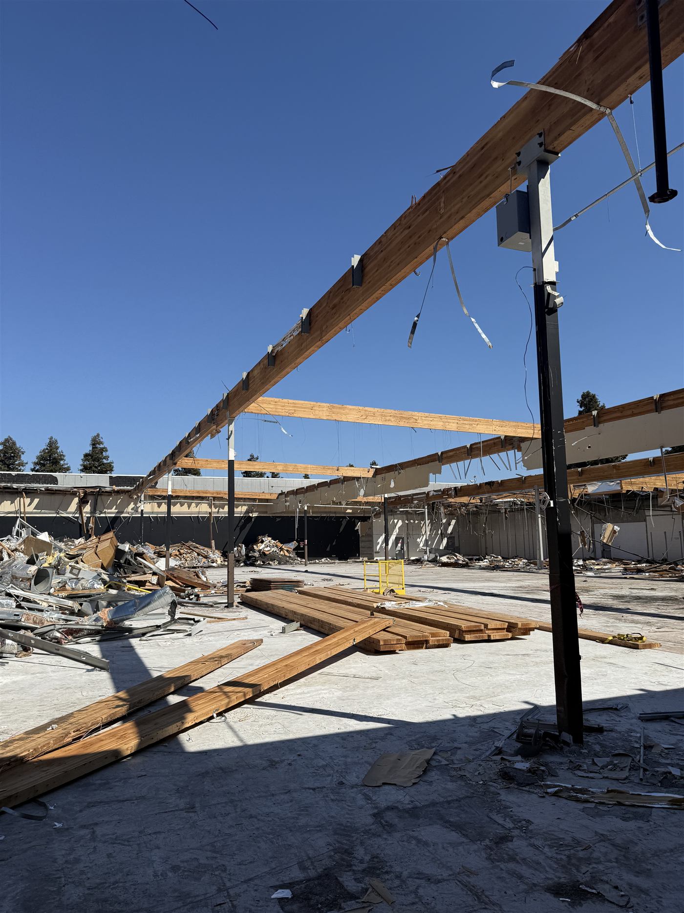 Wood roof beams remaining after a building demolition