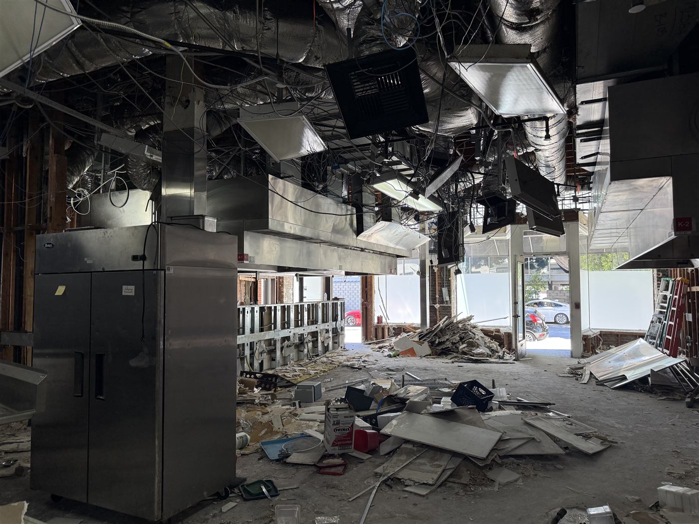 Commercial interior strip-out with exposed ceiling wiring and ductwork
