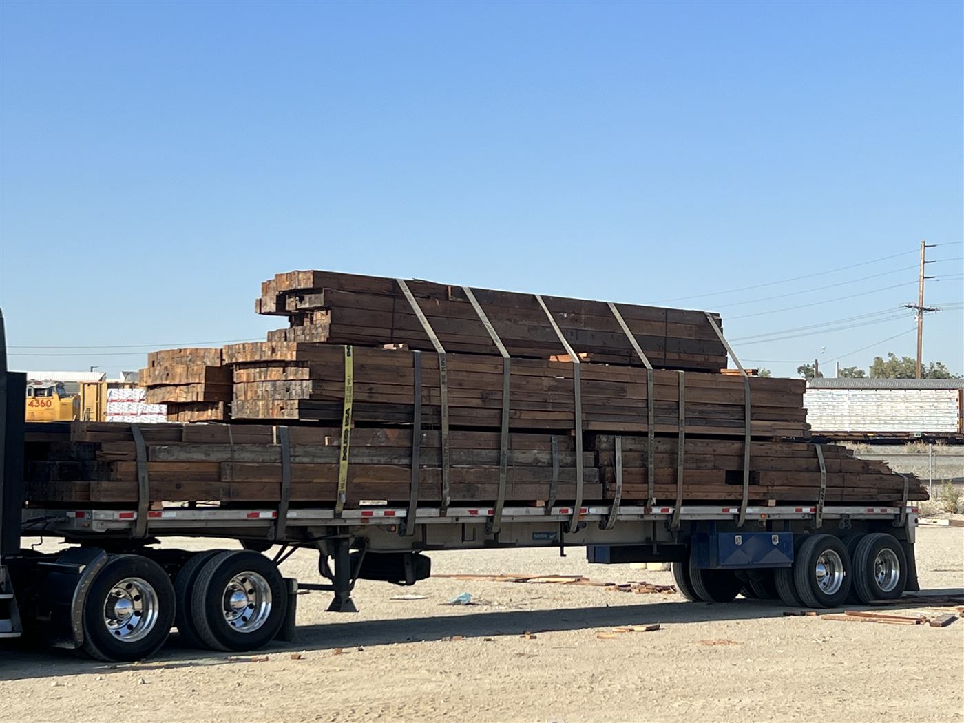 Stacked reclaimed lumber ready for salvage pickup